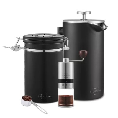 French press set with manual coffee grinder and coffee carafe